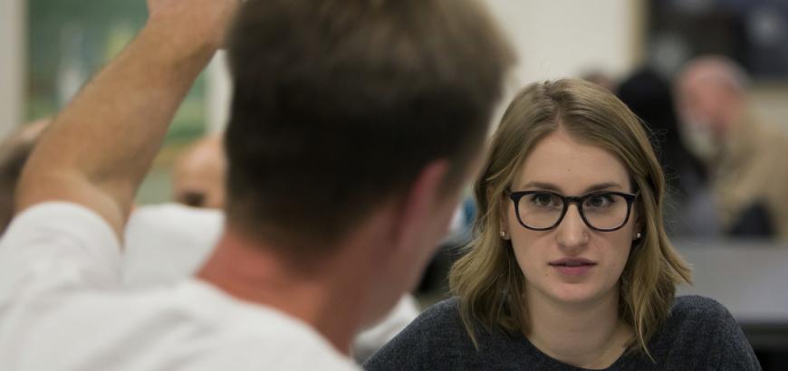 Kathryn Joy, a Law, Societies and Justice and French major, talks with inmate Art Longworth, who was convicted of aggravated murder and is serving life without parole, as they work during a UW mixed-enrollment class at... (Sy Bean/The Seattle Times)