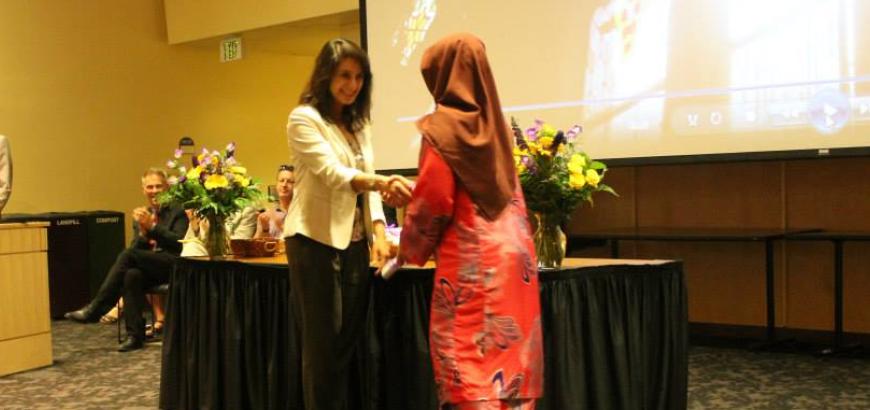 Graduate Nur Abd Rahim Receiving their Degree from Dr. Arzoo Osanloo